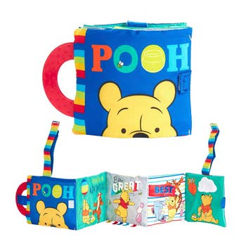 Winnie the Pooh cloth book with teether and tactile pages for baby's sensory development