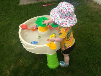 Reviewer's child playing with the water table
