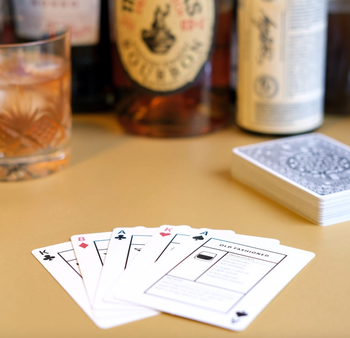 deck of cards with liquor bottles in the back
