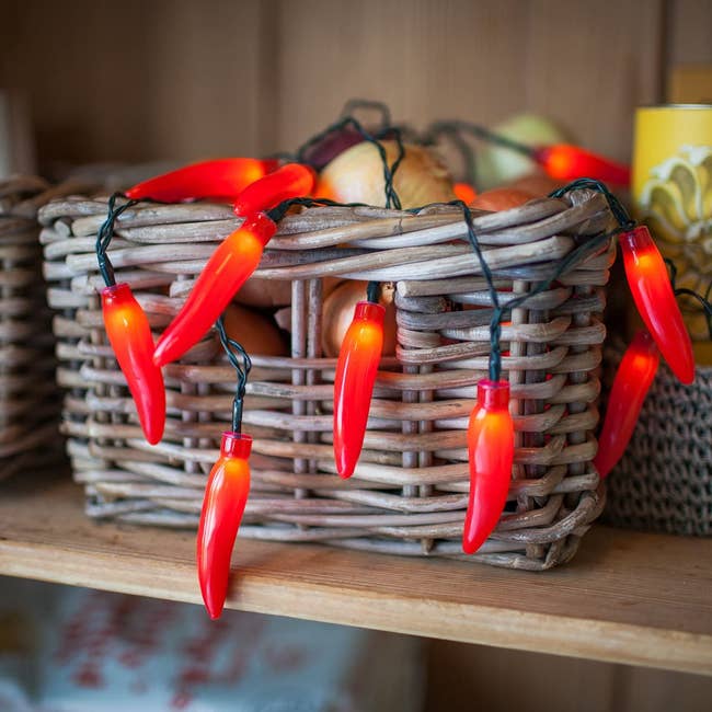 chili pepper lights inside woven basket