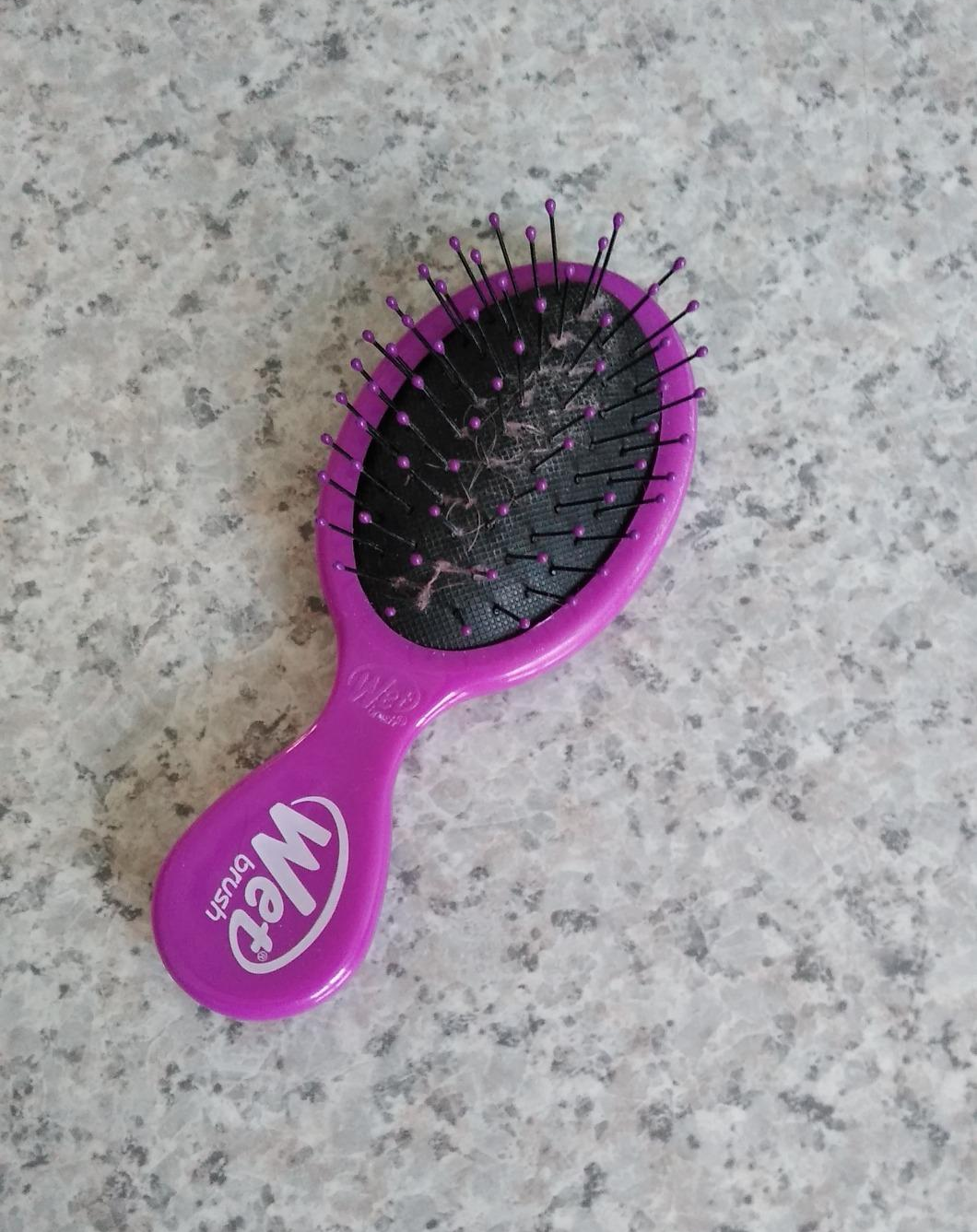 Reviewer photo of the pink mini wet brush