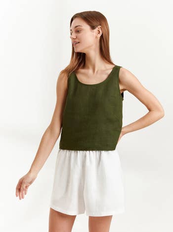 front of model wearing the green tank and white shorts