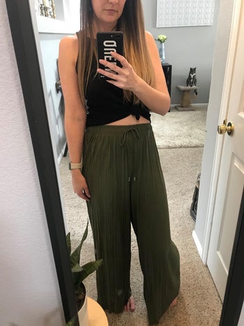 reviewer mirror selfie wearing olive green palazzo pants