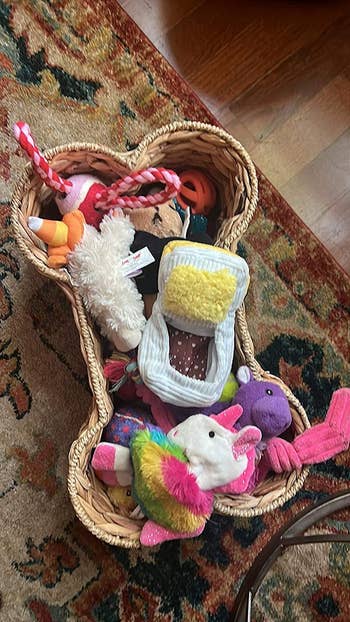 a close up of the basket filled with toys