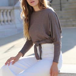 model wearing mauve ribbed version as boatneck knotted at the waist