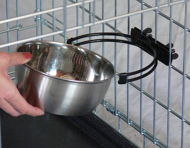 the stainless steel bowl being attached to the metal holder