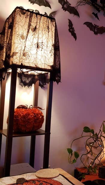 the spider web lampshade on a reviewer's square floor lamp