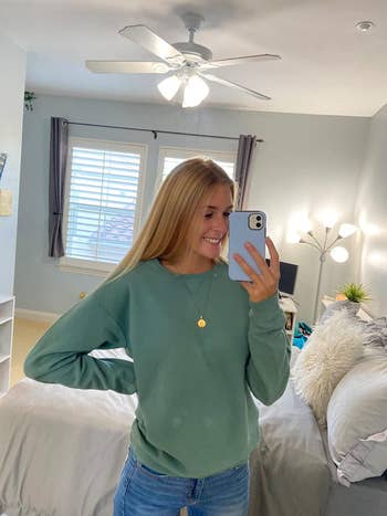 reviewer in the green crewneck