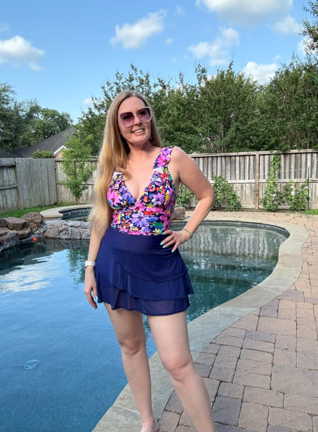 reviewer wearing the blue swim skirt