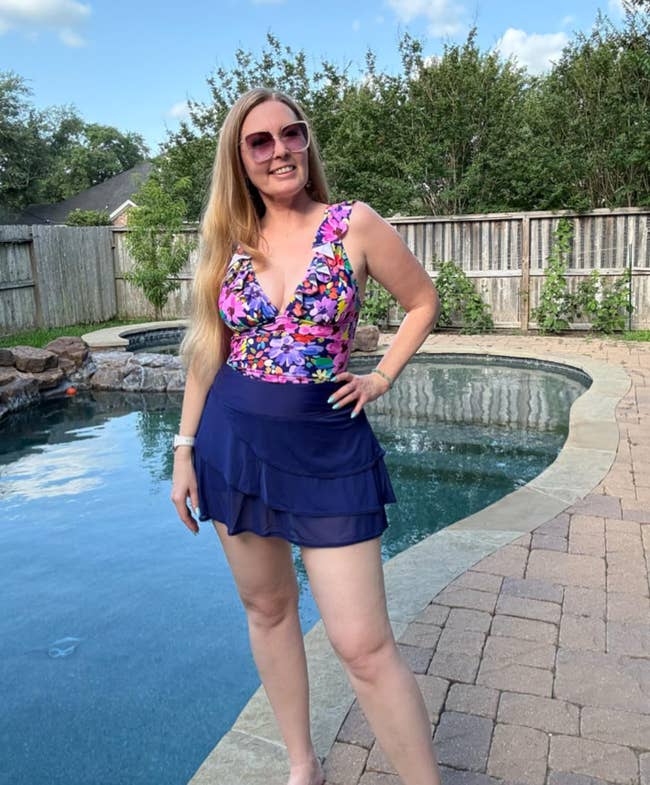 reviewer wearing the blue swim skirt