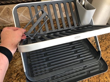 reviewer photo of X-shaped dish rack with utensil holder