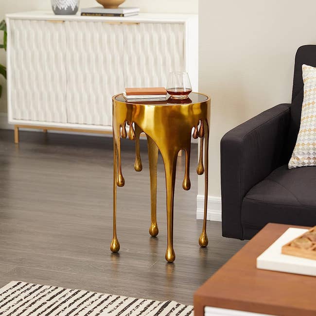 table that looks like dripping gold placed in living room