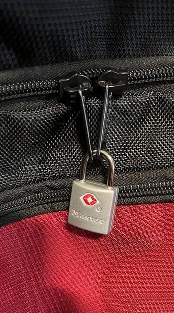 a lock on a reviewer's backpack