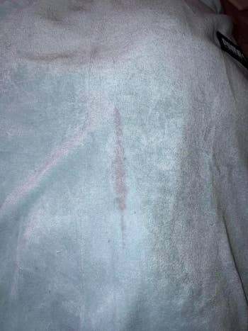 reviewer's shirt with red wine stain