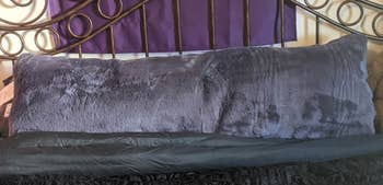 Reviewer image of the purple faux fur pillow
