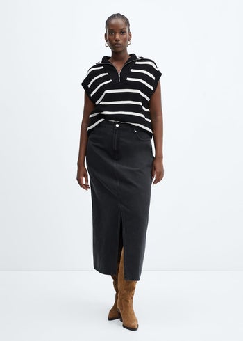 front view of a model wearing the denim skirt in black