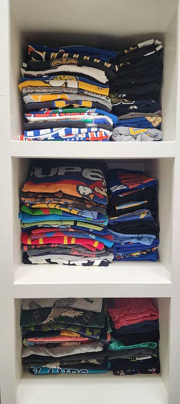 another reviewer's shelves with neatly folded shirts after using the board