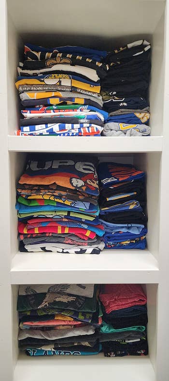another reviewer's shelves with neatly folded shirts after using the board