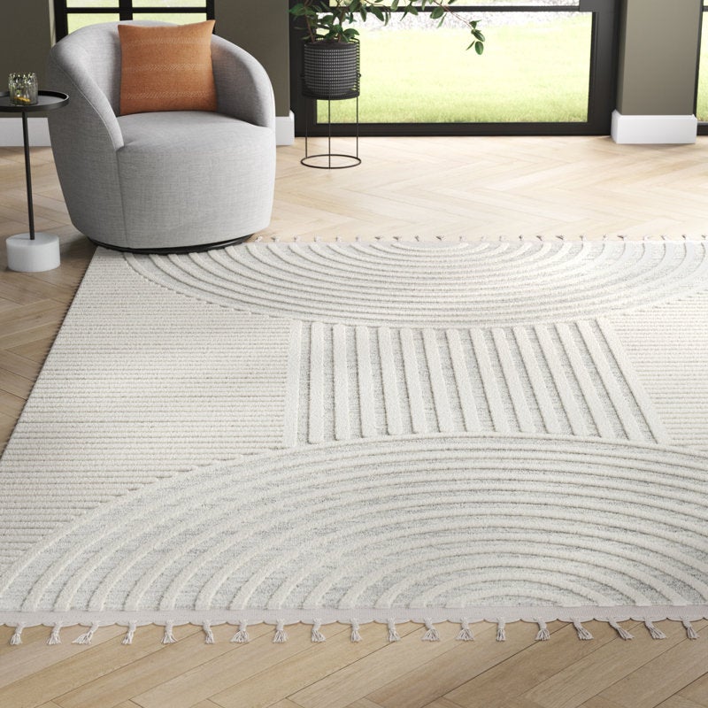 a product shot of the cream rug in a living room