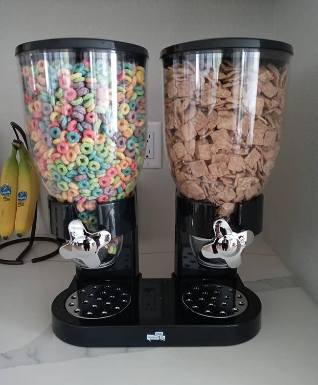 reviewer's black cereal dispenser holding two types of cereal