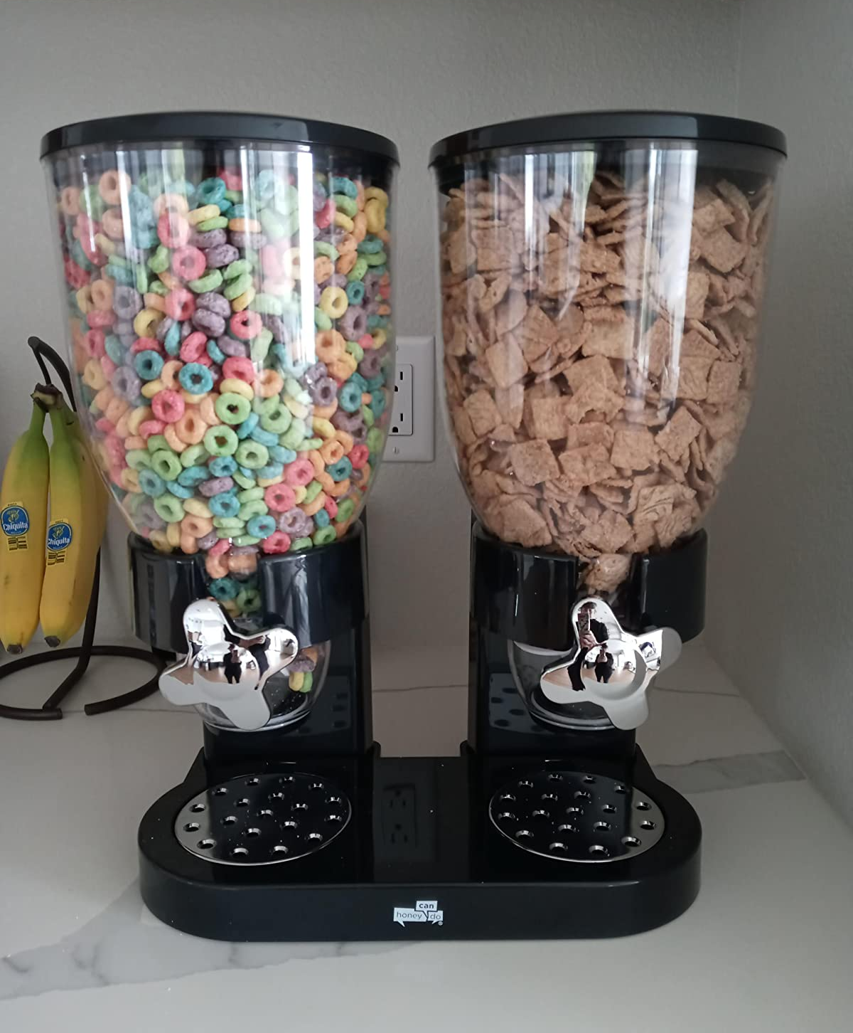 reviewer's black cereal dispenser holding two types of cereal