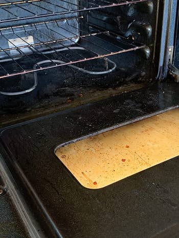 reviewer image of a dirty and stained oven