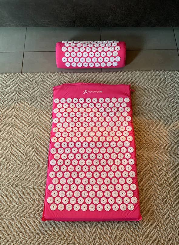 pink and white acupressure mat