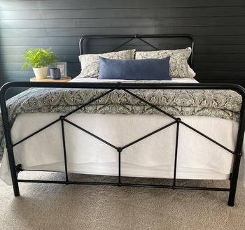 reviewer photo of black farmhouse bed frame in bedroom
