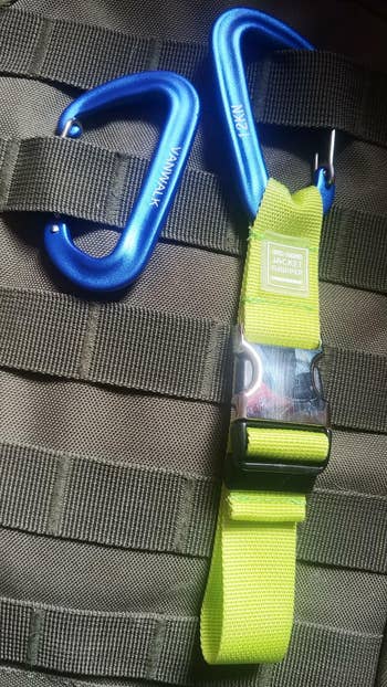a reviewer photo of the luggage strap 