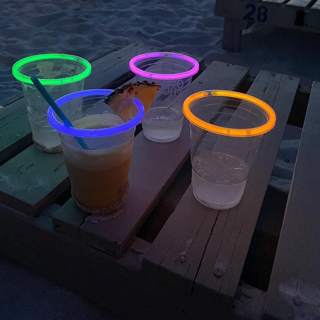 the glowing party cups in green pink orange and blue