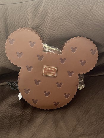 brown bag shaped like mickey head and ears with smaller mickey print