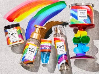 bath and body works pride collection that has rainbow candles candle holder and body products