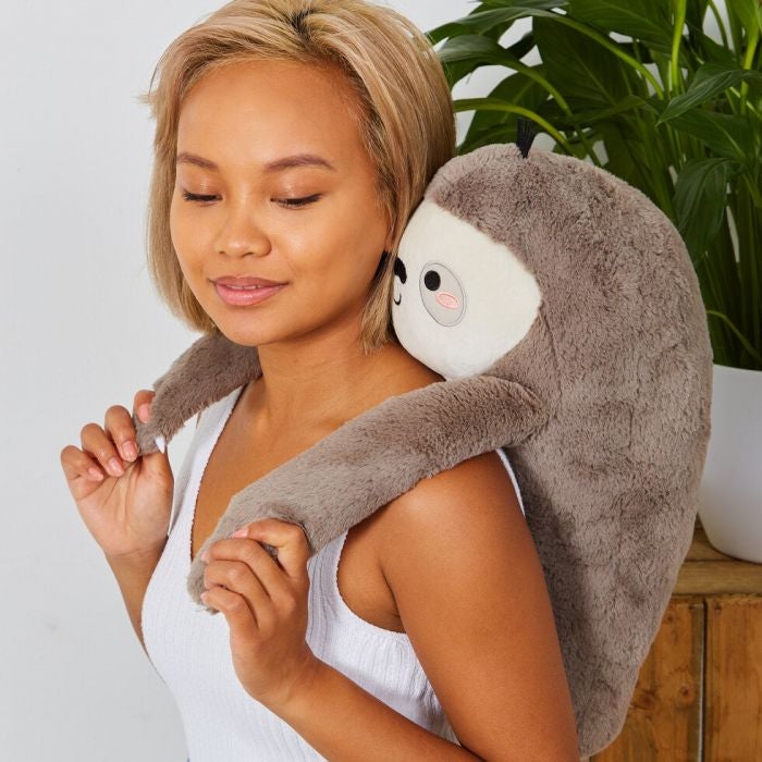 a model wearing the sloth massager on their back