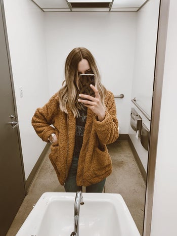 reviewer photo of them wearing a brown teddy shacket