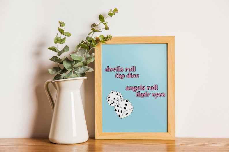 blue print with illustrated dice and pink text reading