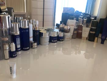 reviewer's dresser with lots of skincare lined up 