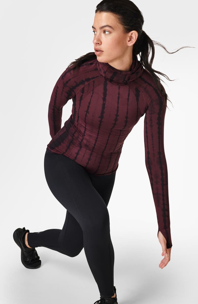 model wearing the long-sleeved top in red tie dye