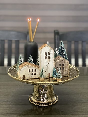 reviewer image of a few mini artificial trees on a centerpiece