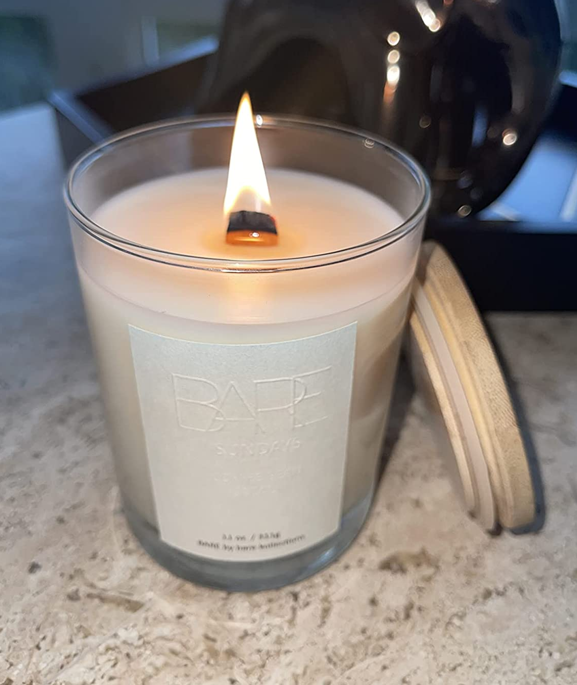 Reviewer image of white candle on a white counter
