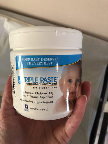 reviewer's photo of a jar of diaper cream