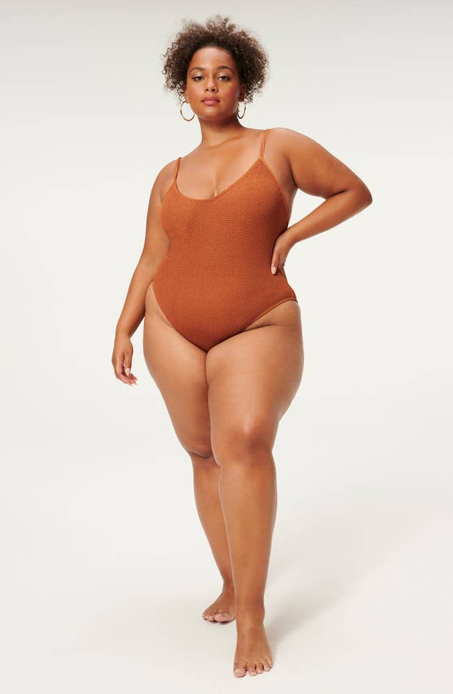 Model in the caramel colored swimsuit with spaghetti straps