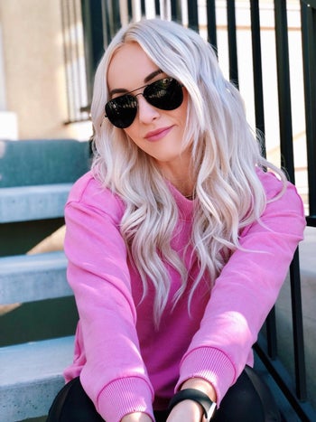 reviewer wearing the black aviator sunglasses