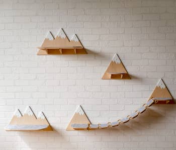 individual shelves that look like triangular mountain tops. one pair has a bridge.