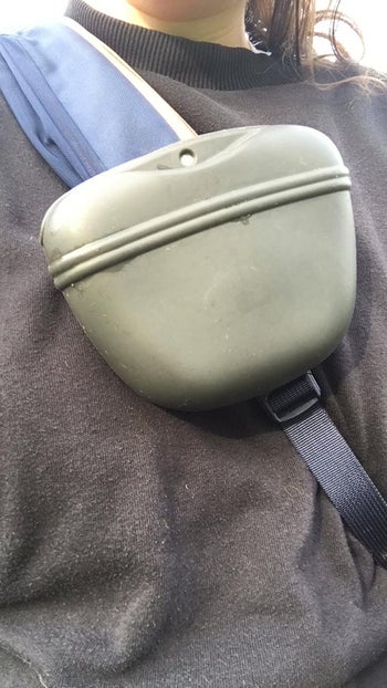 reviewer photo of someone wearing the pouch clipped onto their crossbody bag