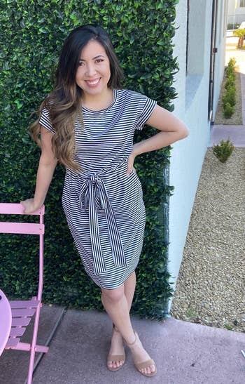 another reviewer wearing the black and white striped dress