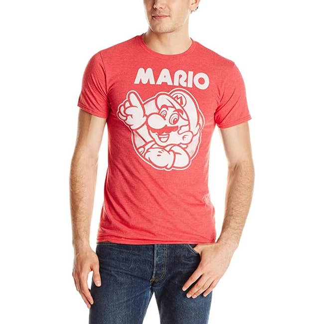 a model in a red t-shirt with mario on it