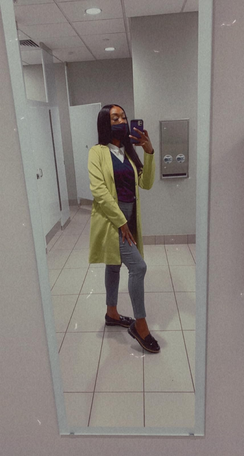 reviewer wearing the loafers and taking a reflector  selfie