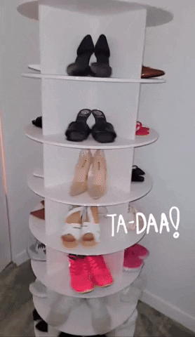 gif of a reviewer's revolving shoe storage display with various styles of women's footwear and 
