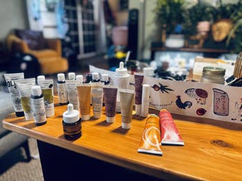 Assorted skincare and quality products are displayed connected a woody array successful a cozy country setting