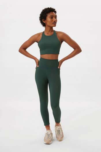 model wearing the green leggings